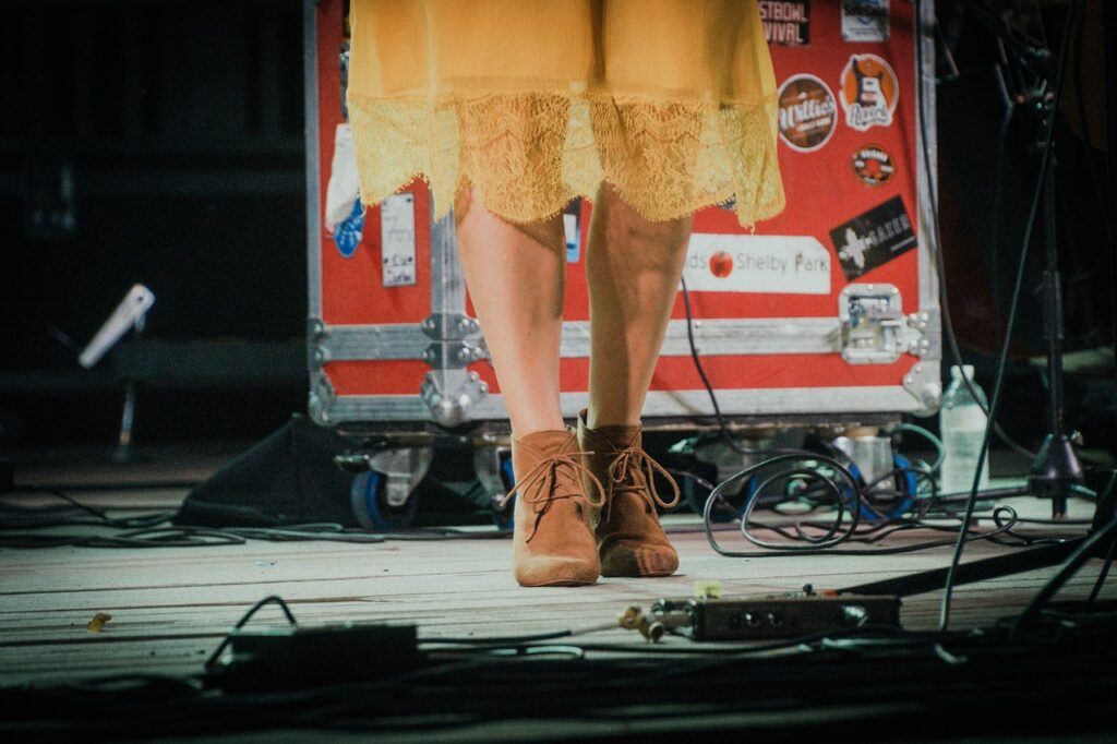 Woman's shoes on stage at a concert
